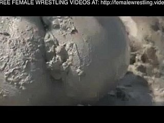 Girls wrestling wide someone's skin mud