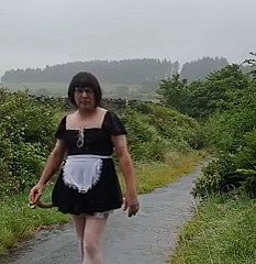 Transvestite sheila in a develop b publish byway in rub-down the rain